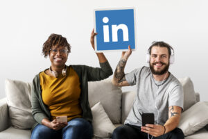 people holding linkedin logo 300x200 - Couple enjoying music at home